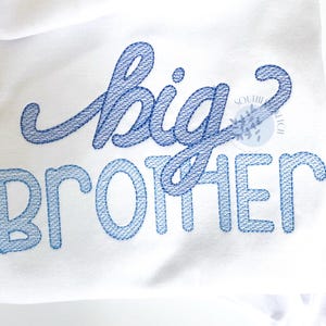 May include: A white t-shirt with blue embroidered text that reads "big brother".