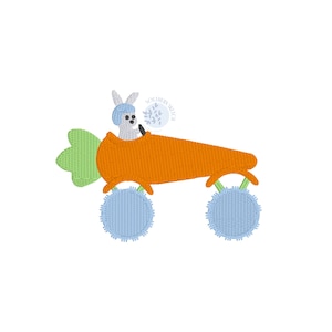 May include: A gray bunny wearing a blue helmet drives a carrot-shaped car with blue pom-pom wheels. The car has a green leafy top. The text "Southern Stitch" is in a circle above the car.