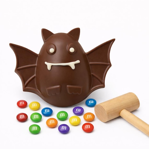 Chocolate Breakable Halloween Bat filled w/ candy. Wooden Hammer included. Hand painted w/ edible gold. TikToc & Insta trending!  BESTSELLER
