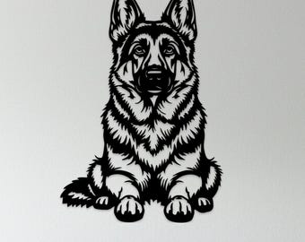 May include: Black metal wall art of a German Shepherd dog in a sitting position. The dog's fur is detailed with intricate lines, and it has a focused expression. The artwork is mounted on a white wall above a gray sofa.