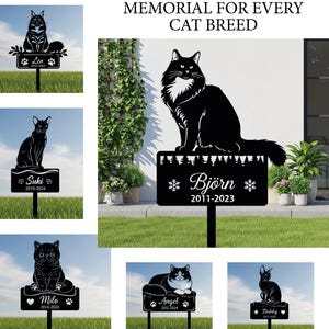 May include: Black metal cat memorial stakes with various cat silhouettes. Each stake features a cat's name and dates. The text "MEMORIAL FOR EVERY CAT BREED" is at the top. The stakes are designed for outdoor use.