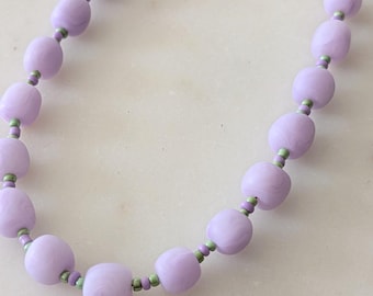 Choker-style necklace in purple and green with handmade polymer clay beads.