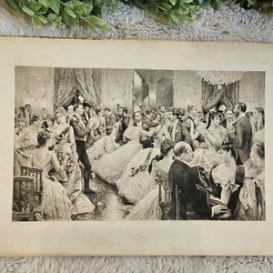 May include: An antique black and white print depicting a formal ball. The image shows a crowded ballroom scene with numerous figures in period attire, including elegant gowns and suits. The print has a vintage aesthetic.