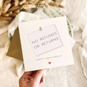 May include: A square white greeting card featuring a light pink sticky note illustration pinned to the center. The text reads NO REFUNDS OR RETURNS in black capital letters, followed by HAPPY ANNIVERSAY and a small red heart icon below.