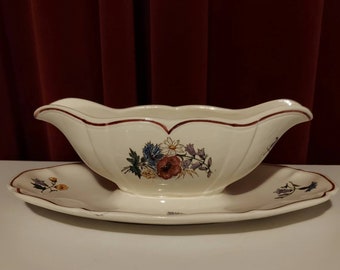 Sauce bowl or gravy bowl from Agreste Saneggemines France decorated with bright colored flowers and dark red lines vintage 50s