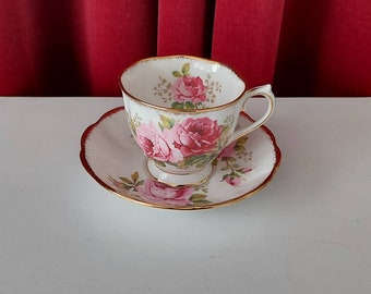 Royal Albert Bone China American Beauty men&#39;s cup and saucer. Decorated with beautiful pink roses and edged with gold lines.