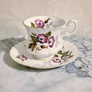 Ladies cup and saucer from Richmond Bone China England decorated with pink flowers and gold lines, vintage 1960s