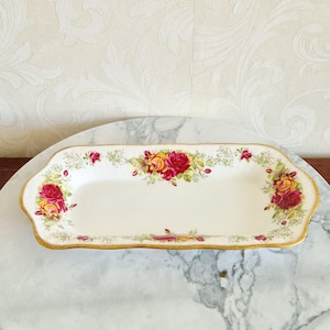 Small rectangular dish of Queens Fine Bone China made in England with Stratford pattern, decorated with colored roses and gold rims