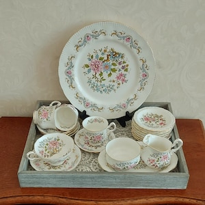 Royal Standard Fine Bone China Mandarin tableware parts decorated with beautiful blue and pink colored flowers and is gold rimmed