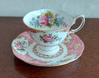 Ladies' cup and saucer Royal Albert Bone China England Lady Carlyle. Vintage 1950s White porcelain with pink color and colored flowers.