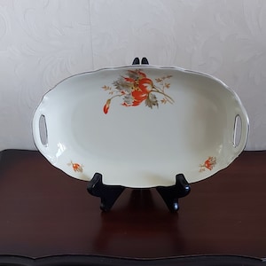Deep oval serving dishes with small handles decorated with orange flowers and silver lines from Tielsch Altwasser Germany, vintage 1930s