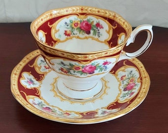Ladies cup and saucer Royal Albert Fine Bone China Lady Hamilton. Vintage 1960s White porcelain with dark red color and colored flowers.