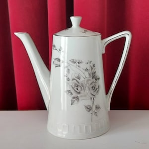Coffee pot designed in clean lines decorated with black roses from Wawel made in Poland vintage 60s.