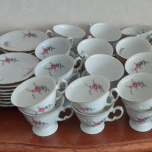 Cup and saucer from Wawel made in Poland beautifully decorated with dark pink and purple colored flowers and gold lines vintage 50s