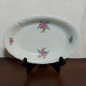 Small deep oval serving bowl from Mosa Maastricht decorated with purple flowers and green leaves vintage 40s
