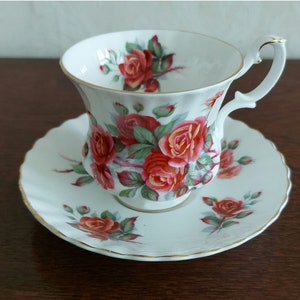 Ladies cup and saucer Royal Albert Bone China Centennial Rose Vintage 70s White porcelain with large dark red roses and gold rimmed