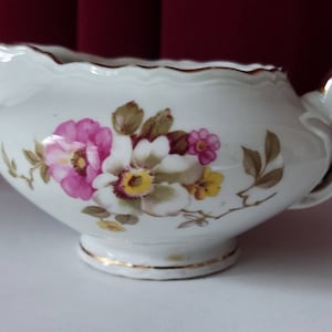 Rare gravy boat or jug from Epiag DF Czechoslovakia, made around 1946, decorated with colored flowers and gold handle and lines.