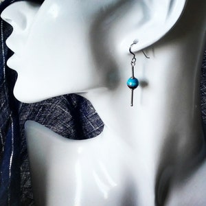 Silver hanging earrings with funny colored agate balls