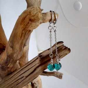 Stainless steel folding earring with a blue Swarovski bead on a 30 mm long chain