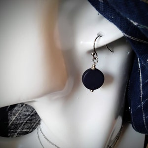 Stainless steel earrings with a midnight blue Polaris coin as a pendant