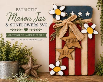 May include: A wooden mason jar cutout painted with red, white, and blue stripes and stars. It features three white and yellow flower cutouts, a hessian bow, and two wooden star ornaments engraved with the words FREEDOM and U.S.A.