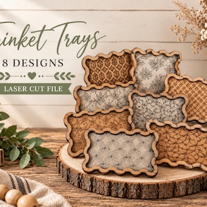 May include: A collection of eight rectangular wooden trinket trays with scalloped edges, featuring various laser-engraved geometric and floral patterns. The text "Trinket Trays 8 DESIGNS LASER CUT FILE" is displayed in the upper left corner of the image.
