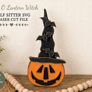 May include: A wooden Jack O Lantern Witch shelf sitter decoration featuring an orange pumpkin base with a black carved face and a tall, black, pointed witch hat adorned with three small black bats. The text reads Jack O Lantern Witch SHELF SITTER SVG LASER CUT FILE.