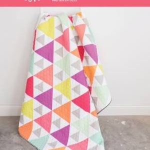 May include: A quilt pattern called "Triangle Peaks" by Quilty Love. The pattern is for a fat quarter quilt and includes baby, throw, twin, and queen sizes.