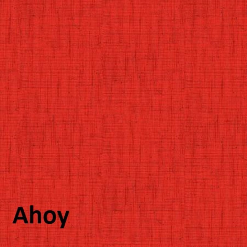 May include: A solid red fabric background with the word "Ahoy" in black text.