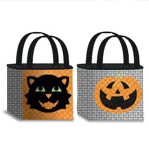 May include: Two square tote bags with black handles. The left bag is orange with a black cat face graphic featuring green eyes. The right bag has a white and black checkered pattern with an orange jack-o'-lantern pumpkin face graphic.