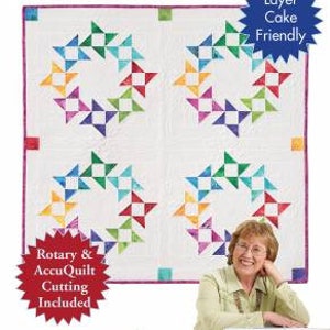 May include: Quilt in a Day pattern for a quilt called Circle of Friends. The quilt is made up of colorful triangles arranged in a circle pattern. The pattern includes rotary and AccuQuilt cutting instructions. The pattern is layer cake friendly.