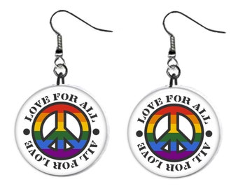 May include: A pair of silver dangle earrings with a white round charm featuring a rainbow peace sign and the text "LOVE FOR ALL LOVE FOR ALL".