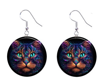 May include: A pair of silver earrings with round black and blue cat face designs. The cat's eyes are green and the fur is a mix of purple, blue, and orange.
