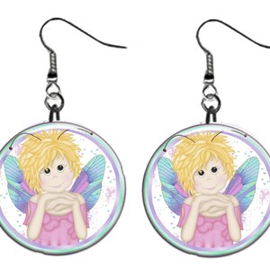 May include: A pair of silver earrings with a round charm featuring a cartoon fairy with blonde hair, blue wings, and a pink dress. The fairy is smiling and has her hands clasped in front of her. The charm is surrounded by a white circle with a purple border and a light blue background with white hearts.
