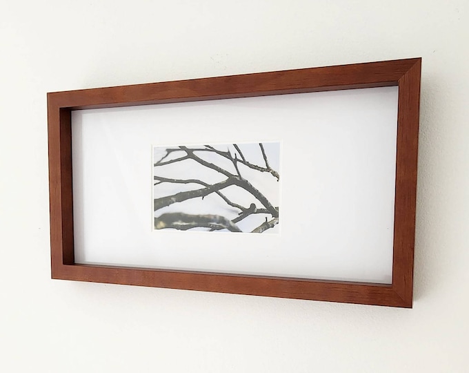 Nail nestled within twigs