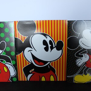 May include: Three panels featuring Mickey Mouse illustrations. Each panel has a different background: green polka dots, red and yellow stripes, and black polka dots. Mickey is depicted in his classic red shorts, yellow shoes, and white gloves.