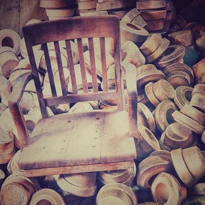 Photo of a Broken Chair in an Abandoned Factory in Brown