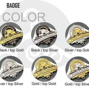 May include: Six different color variations of a graduation badge. The badge is round and features a black and white image of a graduation cap, diploma, and scroll. The text on the badge reads "University of Minnesota" and "Dr. Pamela Crossman Ph. Graduation 12/19/2023".
