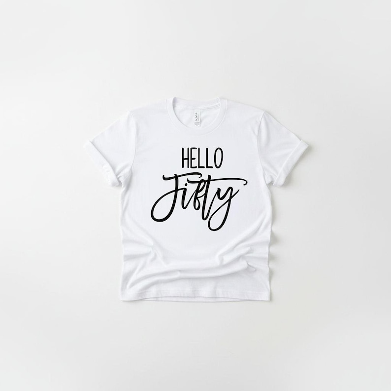 A white t-shirt with the text "HELLO FIFTY" printed on it.