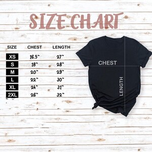 a black t-shirt with measurements and text indicating the size and length of the shirt.