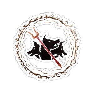 May include: A black and white sticker with a circular design. The center of the sticker features a three-headed dog with a trident piercing through its heads. The dog is surrounded by a gold-colored wreath.