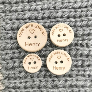 May include: Four wooden buttons with the text "MADE WITH LOVE BY Henry" and a small heart symbol engraved on each button.