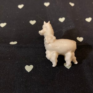 White alpaca pin