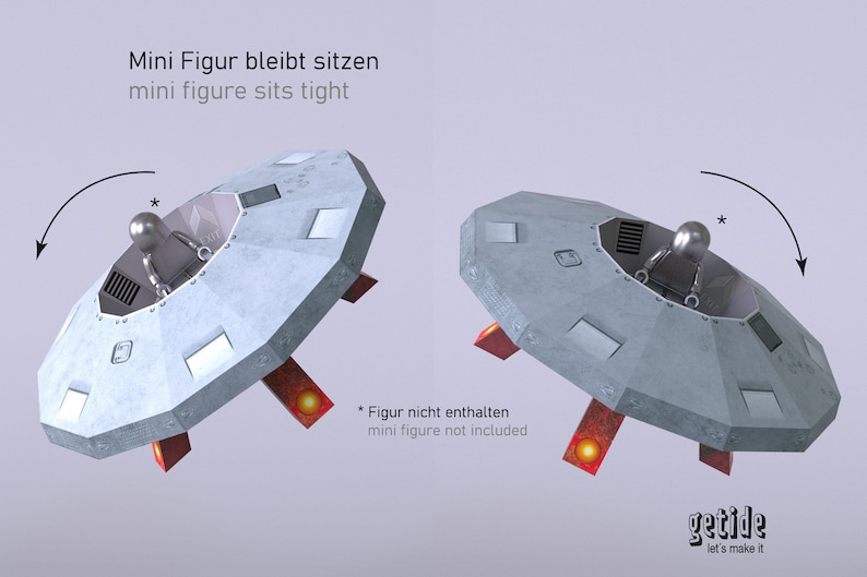 May include: A gray, round, flying saucer with red landing gear. The saucer has a small, round window in the top and a small, round opening in the bottom. The text "Mini Figur bleibt sitzen" and "mini figure sits tight" is printed in black on a white background above the saucer. The text "* Figur nicht enthalten" and "mini figure not included" is printed in black on a white background below the saucer. The text "getide let's make it" is printed in black on a white background below the saucer.