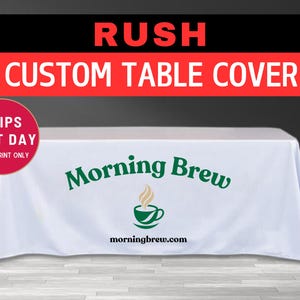 May include: White table cover with green text that reads "Morning Brew" and a green coffee cup icon. The text "morningbrew.com" is also printed in green below the icon.