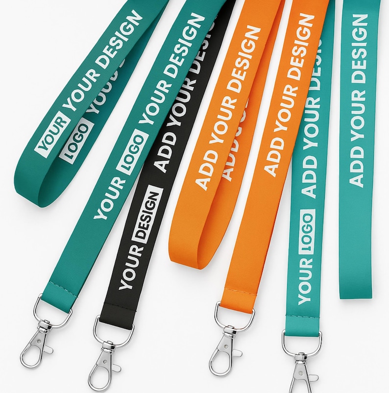 May include: A collection of colorful lanyards with metal clasps. The lanyards are teal, black, and orange, with white text that reads "YOUR LOGO YOUR DESIGN" and "ADD YOUR DESIGN".