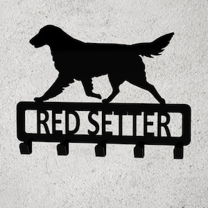 May include: Black metal key holder with a silhouette of a red setter dog and the text "RED SETTER" on a rectangular plaque. The key holder has five hooks.