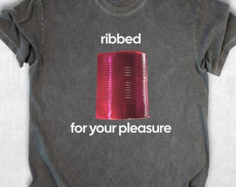 May include: Gray t-shirt with the words "ribbed" and "for your pleasure" in white. A red, ribbed can is centered between the text. The shirt has a crew neck and short sleeves.