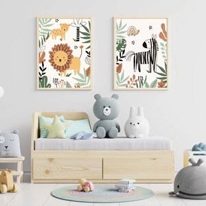 May include: Two framed illustrations of jungle animals. The first illustration features a lion and a leopard in a green jungle setting. The second illustration features a zebra and a turtle in a green jungle setting.