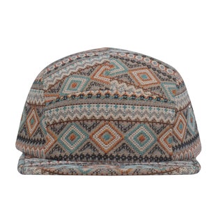 May include: A brown, blue and orange patterned baseball cap with a geometric design.